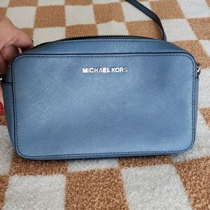 Small side bag in Carolina blue. Has a couple of stains on the front n side.